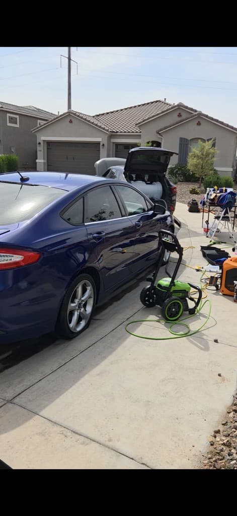 Thompson's mobile detailing equipment set up at a customer's home